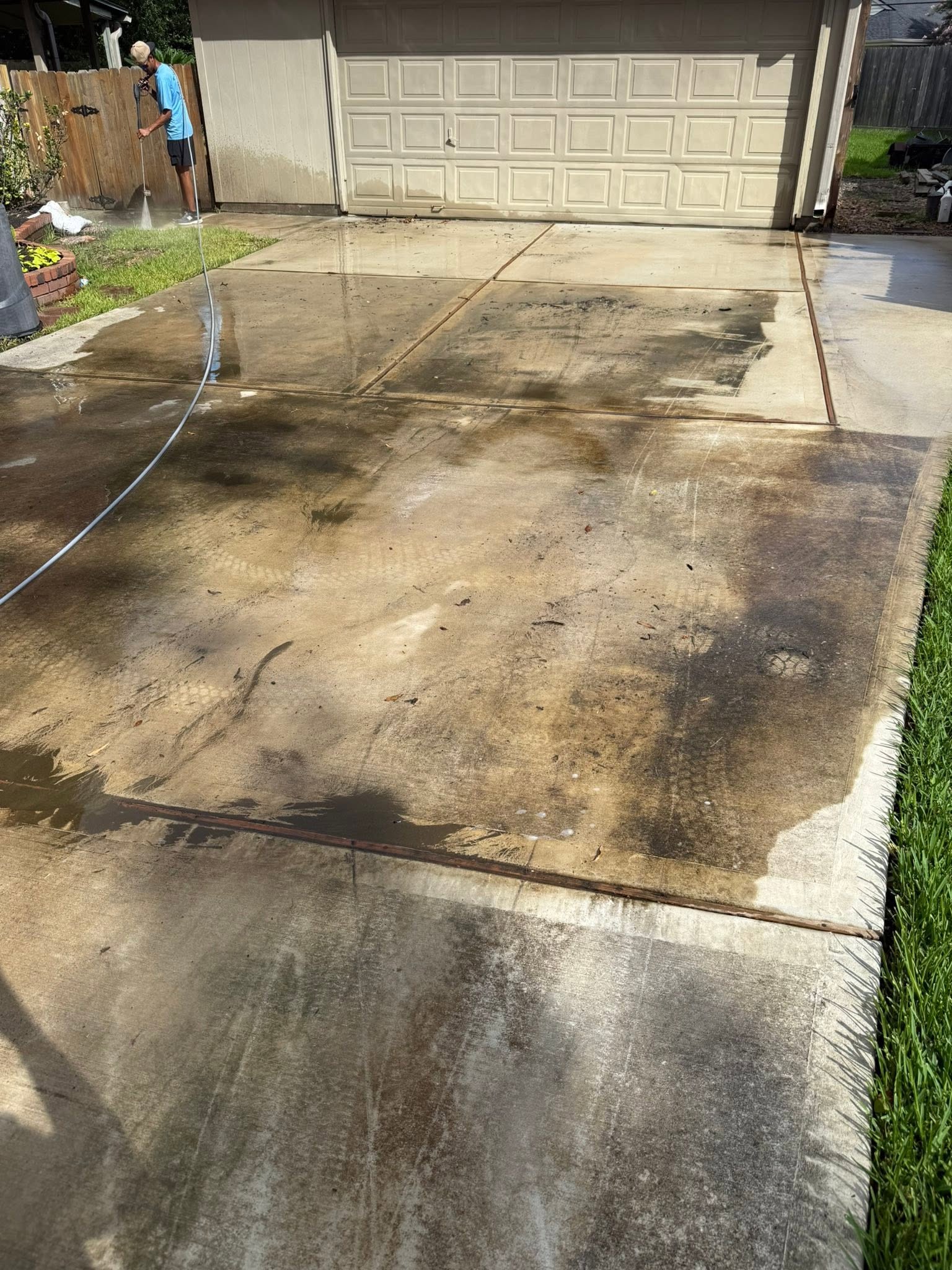 Driveway before cleaning, stained and dirty
