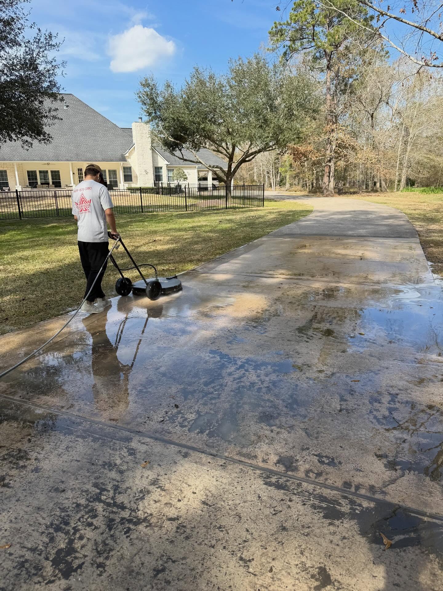 Pressure washing a driveway