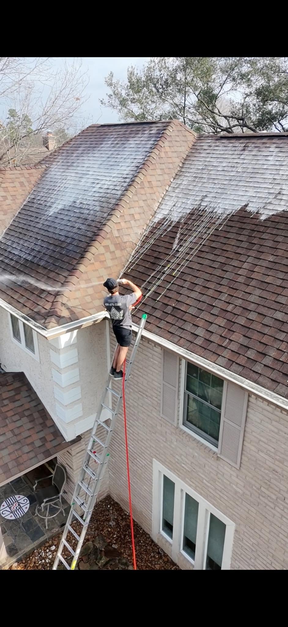 Clean Kings crew soft washing a roof